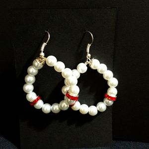 Handmade hoop pearl earrings with a dash of red